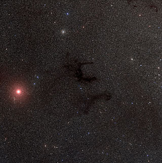 Dark Nebulae B142-43 in Aquila.