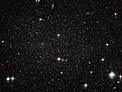 Antlia Dwarf Galaxy Peppers the Sky with Stars