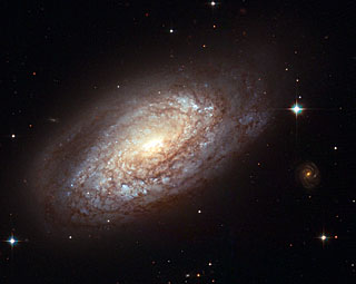 Galaxy  
NGC 2397 with an explosive secret