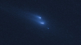 Disintegrating asteroid P/2013 R3 as viewed by Hubble on 15 November 2013