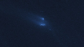 Disintegrating asteroid P/2013 R3 as viewed by Hubble on 13 December 2013