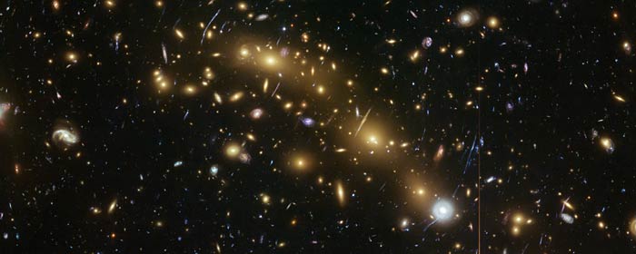 This image from the NASA/ESA Hubble Space Telescope shows the galaxy cluster MCS J0416.1–2403. This is one of six being studied by the Hubble Frontier Fields programme. This programme seeks to analyse the mass distribution in these huge clusters and to use the gravitational lensing effect of these clusters, to peer even deeper into the distant Universe.