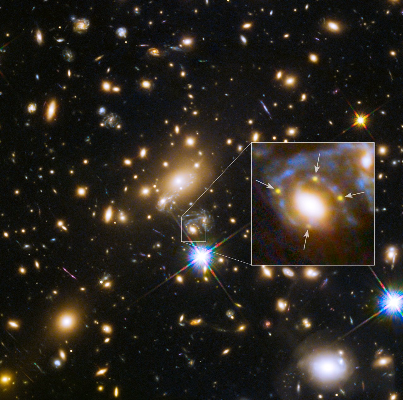 This image shows the huge galaxy cluster MACS J1149+2223, whose light took over 5 billion years to reach us.