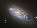 The peculiar asymmetry of NGC 949