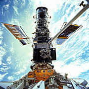 Hubble berthed in the Space Shuttle bay during Servicing Mission 3A.